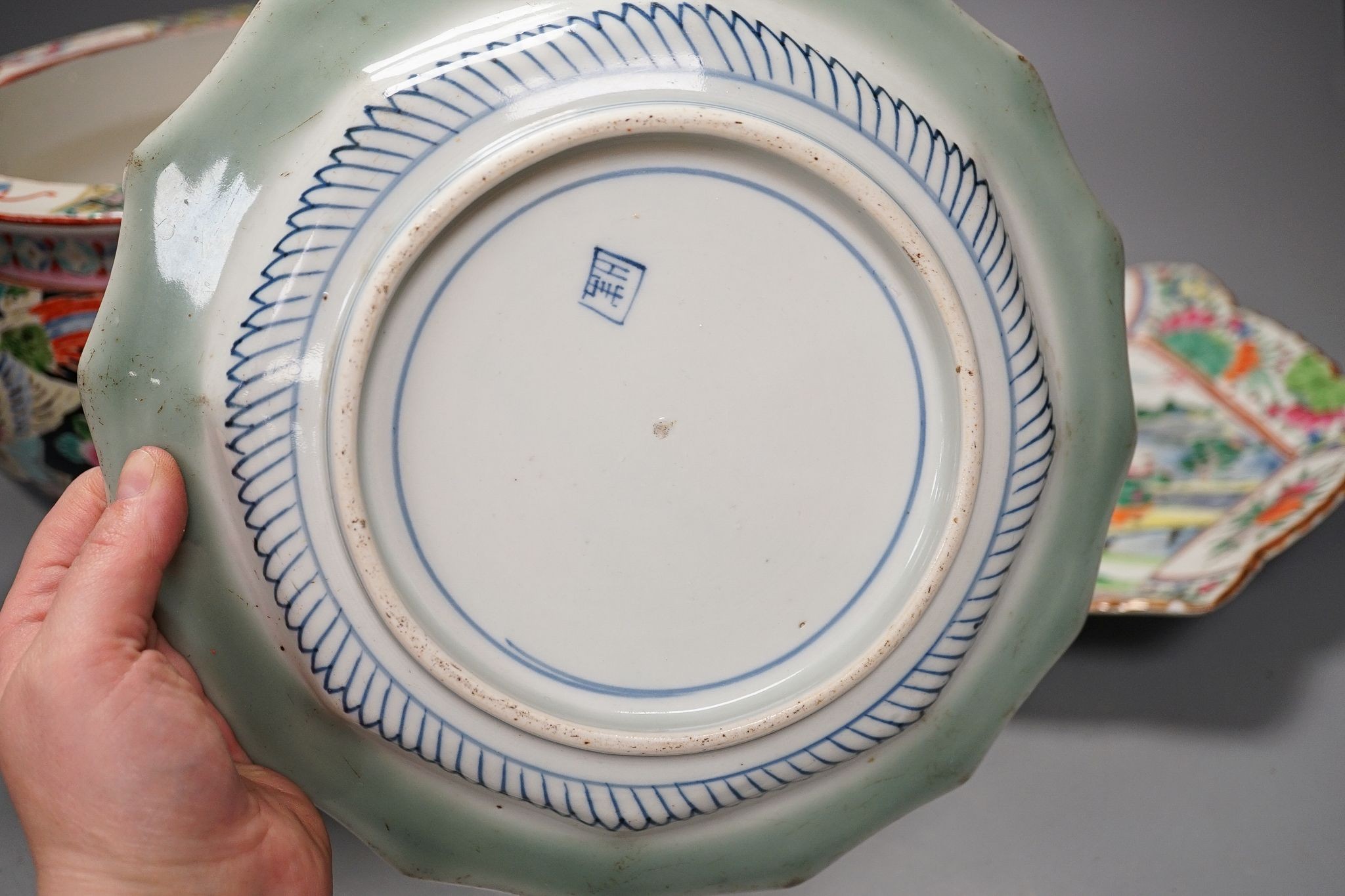 Three late 19th century Japanese porcelain dishes and a jardiniere, 19 cms high.